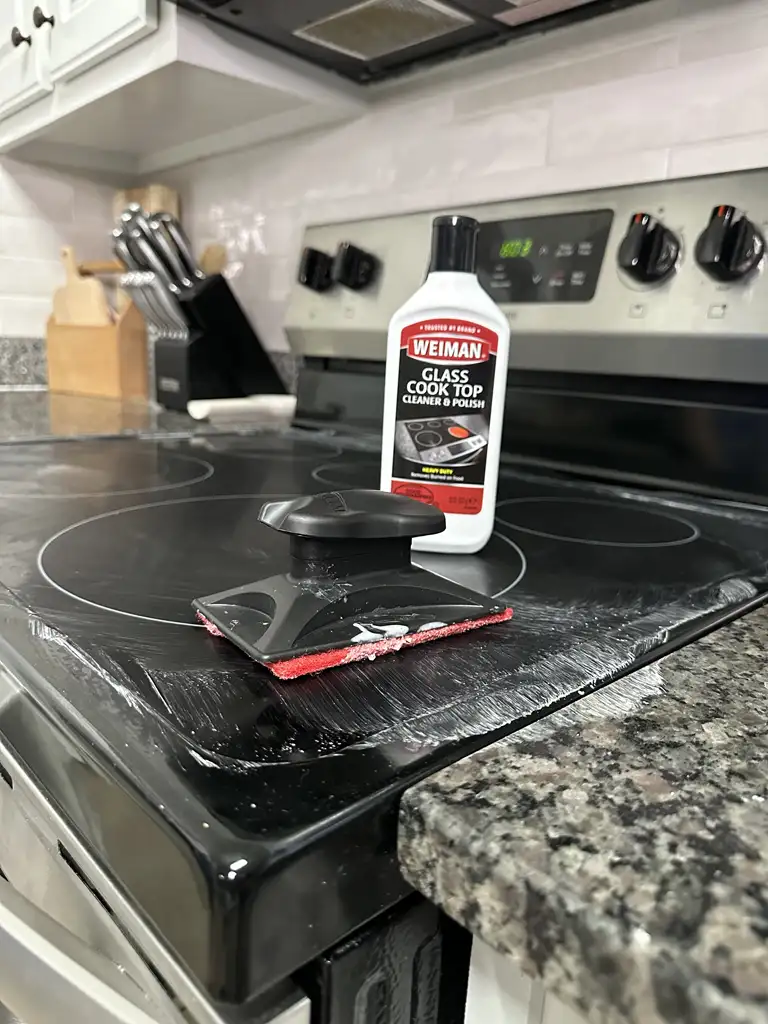 Glass cooktop being detailed with Bozman Cleaning products