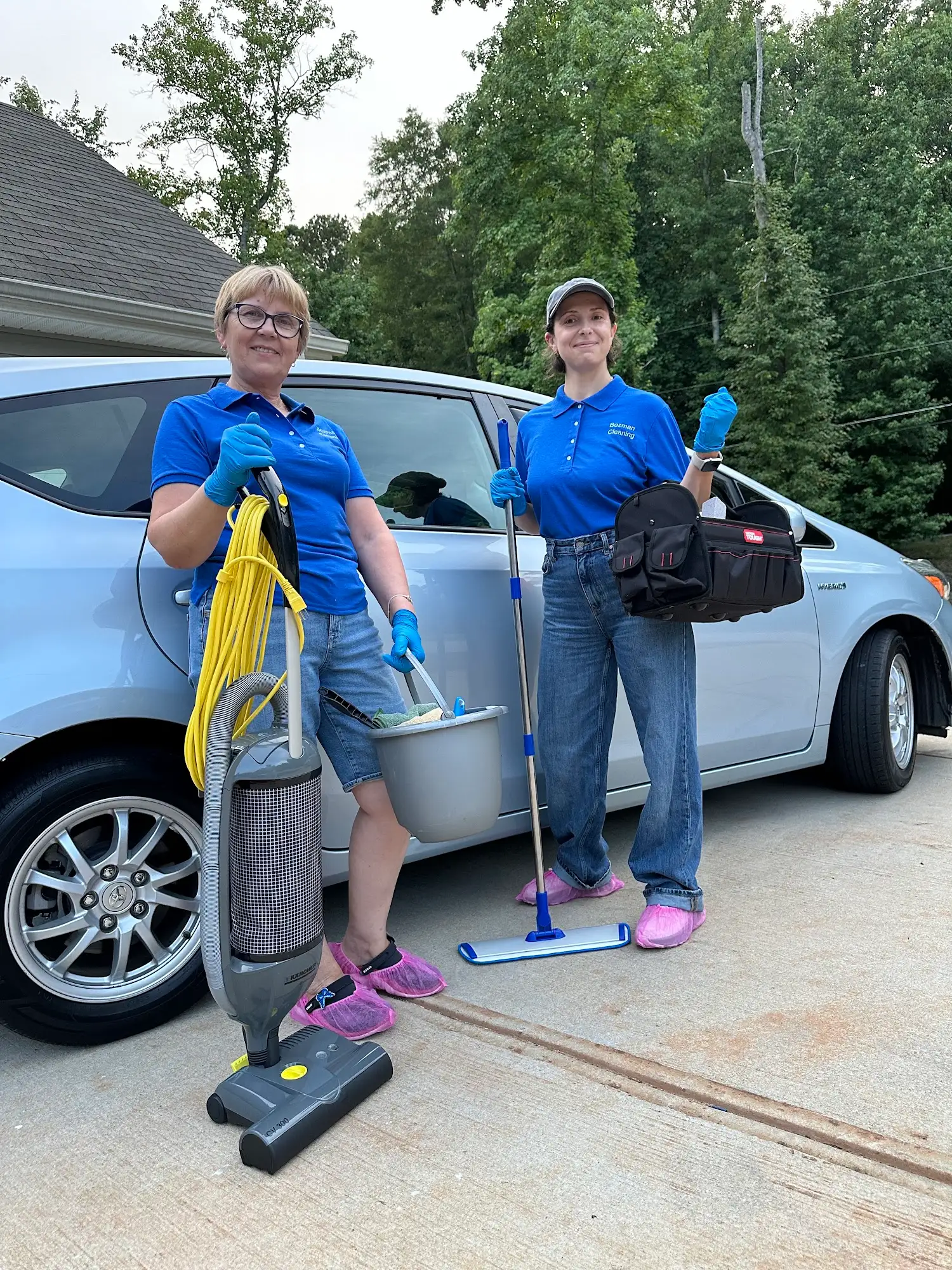 Bozman Cleaning team in blue uniforms with professional cleaning equipment